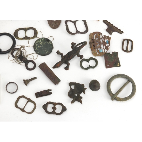 629 - Large selection of metal detecting finds including belt buckles