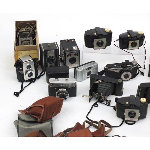 315 - Vintage cameras with cases and accessories including Praktica and Minolta examples