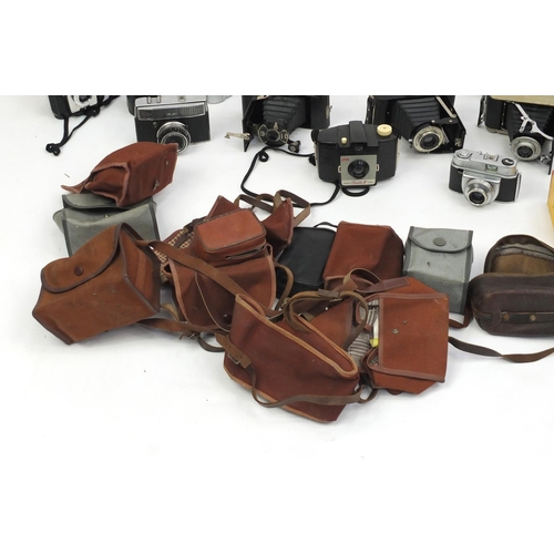 315 - Vintage cameras with cases and accessories including Praktica and Minolta examples