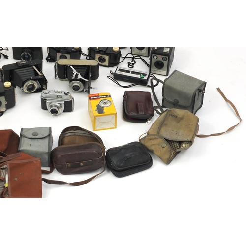 315 - Vintage cameras with cases and accessories including Praktica and Minolta examples