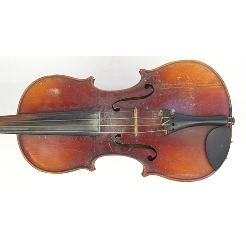 136 - Old wooden violin with scrolled neck, violin bow and fitted case, the violin back 14.75