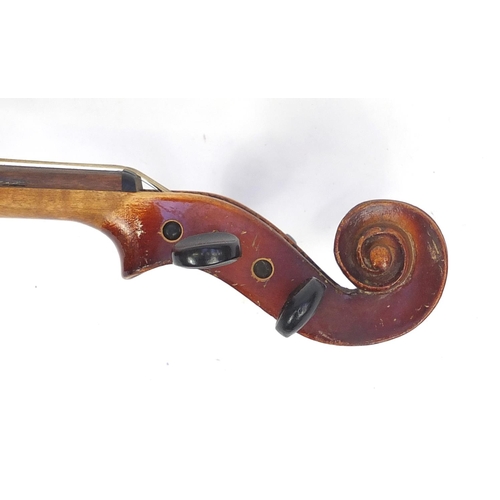 136 - Old wooden violin with scrolled neck, violin bow and fitted case, the violin back 14.75