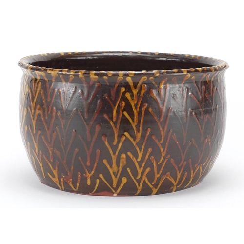 528 - Slipware pottery bowl with weaving bone design, 26cm in diameter