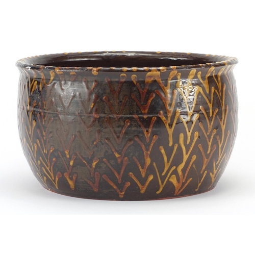 528 - Slipware pottery bowl with weaving bone design, 26cm in diameter