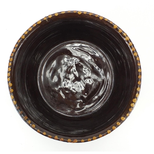 528 - Slipware pottery bowl with weaving bone design, 26cm in diameter