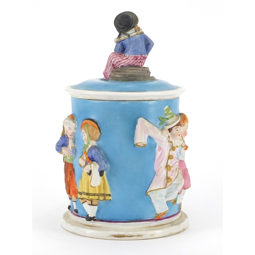 526 - 19th century porcelain sailor boy tobacco jar and cover, decorated in relief with continuous band of... 