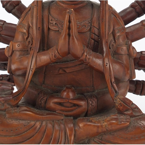 398 - Chinese hardwood carved figure of seated Buddha with detachable arms, 23.5cm high