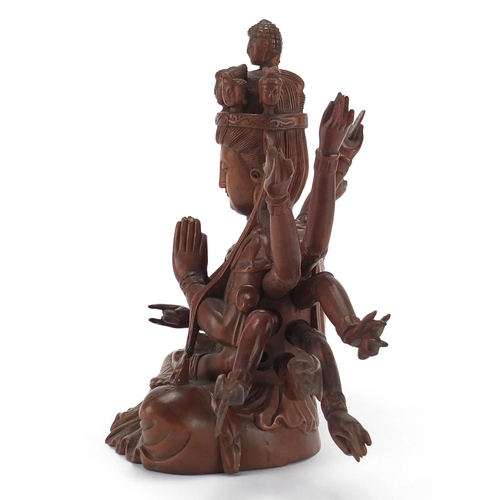 398 - Chinese hardwood carved figure of seated Buddha with detachable arms, 23.5cm high