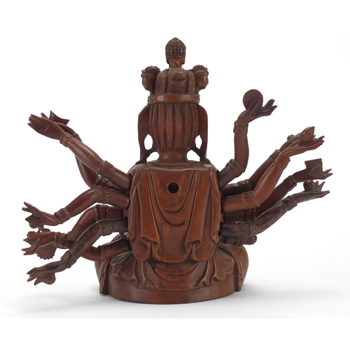 398 - Chinese hardwood carved figure of seated Buddha with detachable arms, 23.5cm high