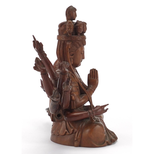 398 - Chinese hardwood carved figure of seated Buddha with detachable arms, 23.5cm high