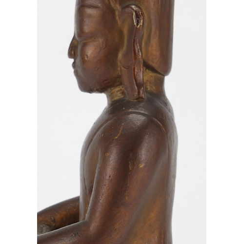 397 - Gilt and black painted carved wooden figure of Buddha, 39cm high