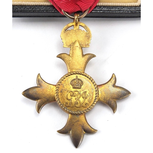 272 - Silver gilt OBE with dress medal, housed in a fitted tooled leather case
