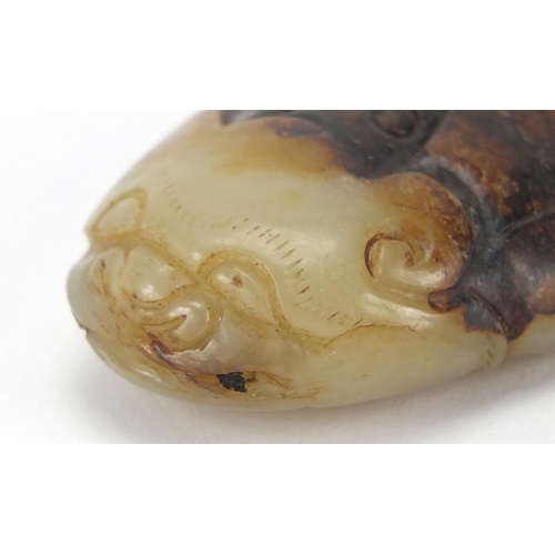 427 - Chinese pale green and russet jade carving of a beetle, 5.5cm in length