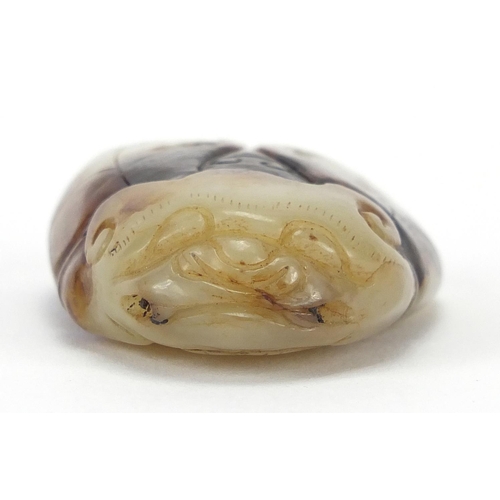 427 - Chinese pale green and russet jade carving of a beetle, 5.5cm in length