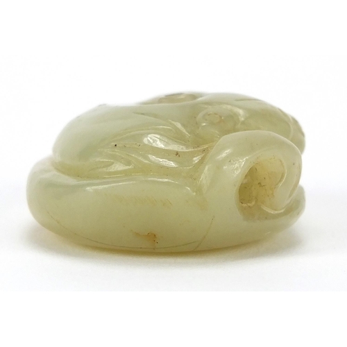 428 - Chinese green jade carving of a mythical recumbent cat upon a lily pad, 4.5cm wide