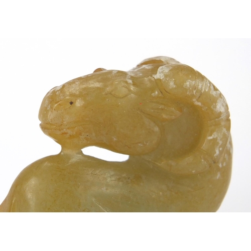 424 - Chinese russet and green jade carving of a lamb, 5cm high