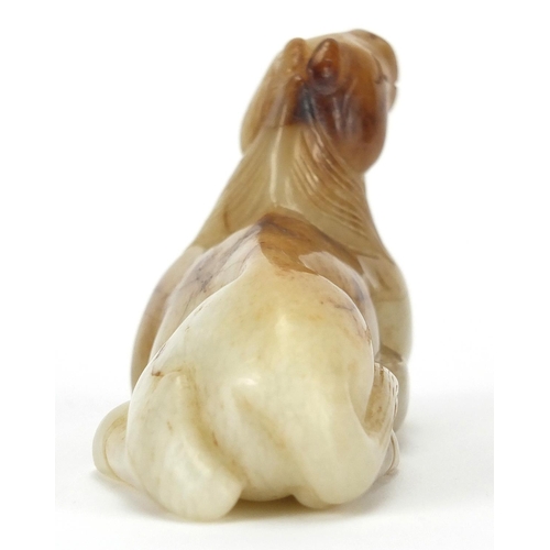 417 - Chinese white and russet jade carving of a recumbent horse, 8cm in length