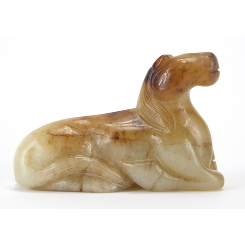 417 - Chinese white and russet jade carving of a recumbent horse, 8cm in length