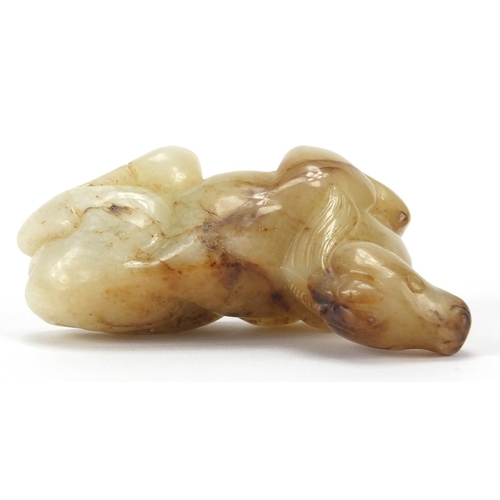 417 - Chinese white and russet jade carving of a recumbent horse, 8cm in length