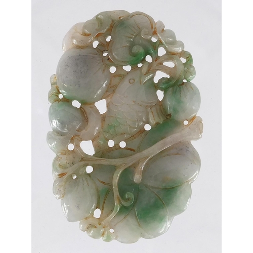 430 - Chinese white and green jade pendant, carved and pierced with a fish and fruit, 9.5cm high