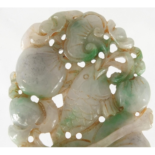 430 - Chinese white and green jade pendant, carved and pierced with a fish and fruit, 9.5cm high