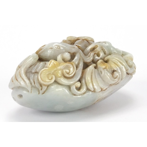 429 - Chinese white jade touch stone carved with a bird of Paradise and a bat, 8.5cm high