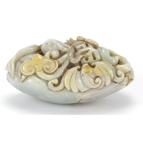 429 - Chinese white jade touch stone carved with a bird of Paradise and a bat, 8.5cm high