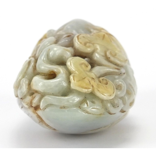 429 - Chinese white jade touch stone carved with a bird of Paradise and a bat, 8.5cm high