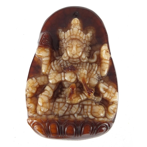 432 - Tibetan brown and white jade pendant carved with a Goddess, 4.5cm high