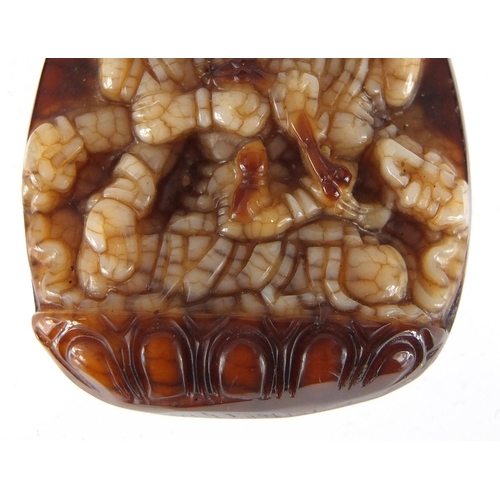 432 - Tibetan brown and white jade pendant carved with a Goddess, 4.5cm high