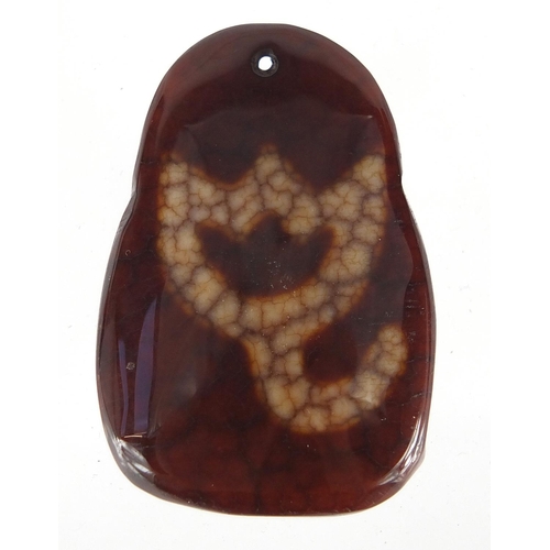 432 - Tibetan brown and white jade pendant carved with a Goddess, 4.5cm high