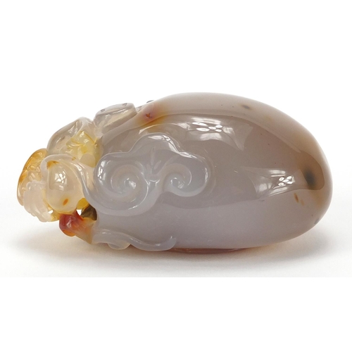 435 - Chinese pale agate touch stone, carved with a dragon, 10cm high