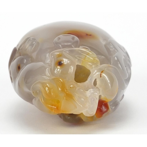 435 - Chinese pale agate touch stone, carved with a dragon, 10cm high