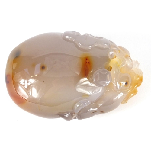 435 - Chinese pale agate touch stone, carved with a dragon, 10cm high