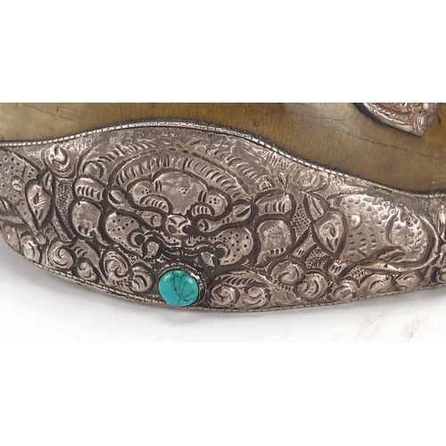 467 - Tibetan silver mounted Conch shell set with coral and turquoise stones, the silver mounts embossed w... 