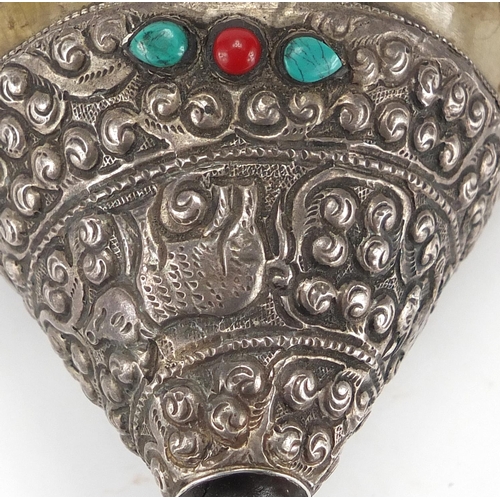 467 - Tibetan silver mounted Conch shell set with coral and turquoise stones, the silver mounts embossed w... 