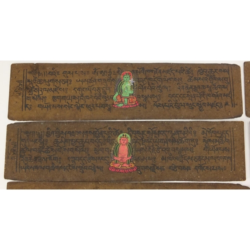 473 - Tibetan carved wood prayer box set with turquoise and coral stones, containing various paper scriptu... 