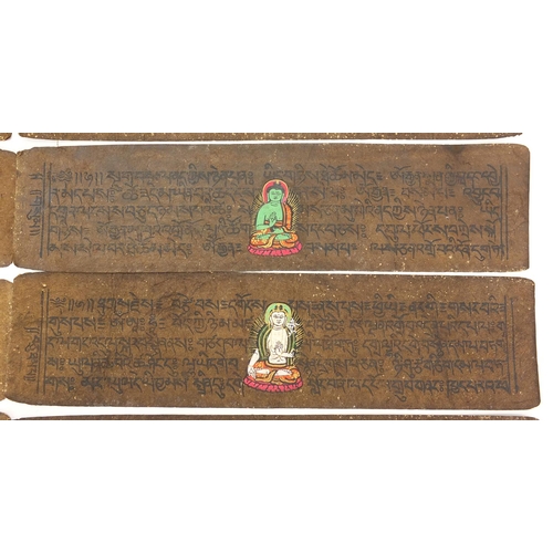 473 - Tibetan carved wood prayer box set with turquoise and coral stones, containing various paper scriptu... 