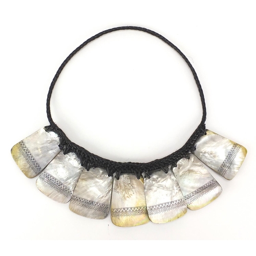 482 - Indian Goa style Mother of Pearl shell necklace, each having a geometric design, 34cm wide