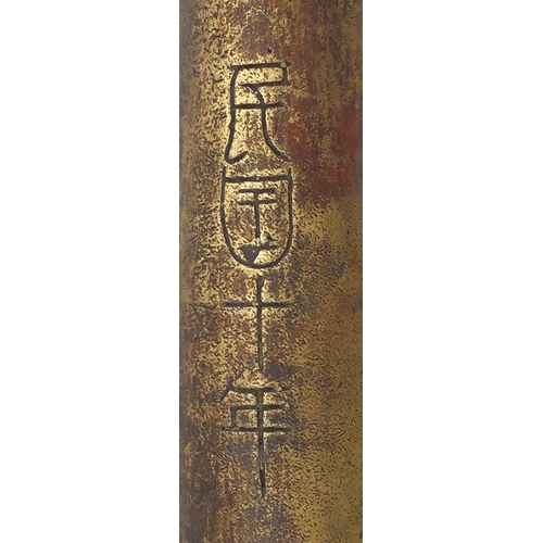 399 - Chinese bronze triple hand cannon with impressed character marks, 42.5cm in length