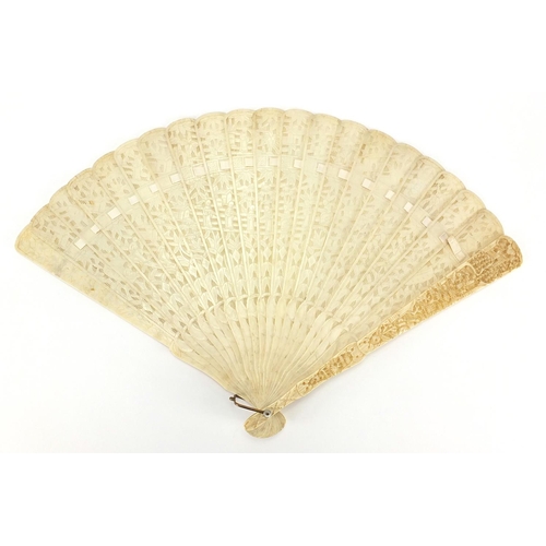 436 - Chinese Canton ivory fan, the guards carved with figures amongst pagodas and bridges, the sticks wit... 