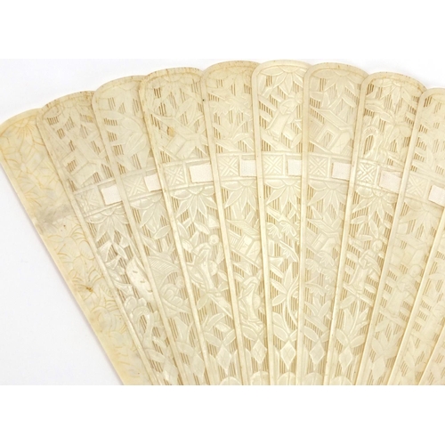 436 - Chinese Canton ivory fan, the guards carved with figures amongst pagodas and bridges, the sticks wit... 