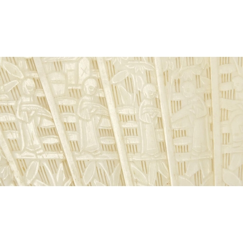 436 - Chinese Canton ivory fan, the guards carved with figures amongst pagodas and bridges, the sticks wit... 