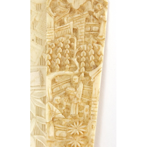 436 - Chinese Canton ivory fan, the guards carved with figures amongst pagodas and bridges, the sticks wit... 