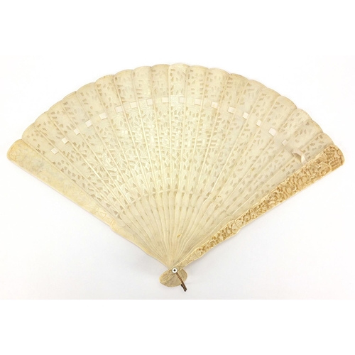 436 - Chinese Canton ivory fan, the guards carved with figures amongst pagodas and bridges, the sticks wit... 