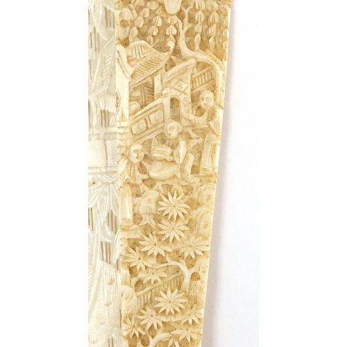 436 - Chinese Canton ivory fan, the guards carved with figures amongst pagodas and bridges, the sticks wit... 