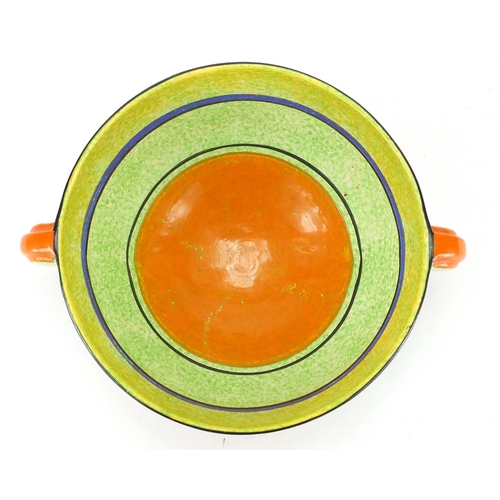 555 - Clarice Cliff Bizarre Bobbins three footed bowl with twin handles, hand painted onto a green cafe-au... 