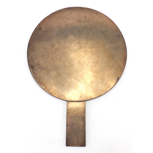 402 - Oriental polished bronze hand mirror cast with cranes and character marks, 34cm in length