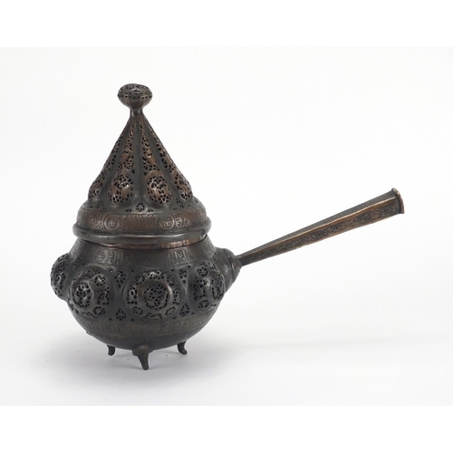 472 - Islamic bronze incense burner with open metal work, embossed with wild animals, 24cm high