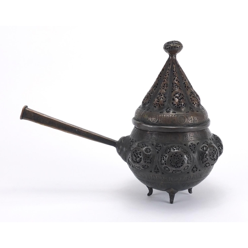 472 - Islamic bronze incense burner with open metal work, embossed with wild animals, 24cm high